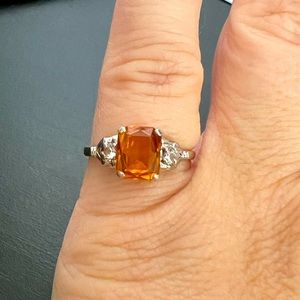 Size 6 10 K white gold band with topaz middle diamond & two small white diamonds